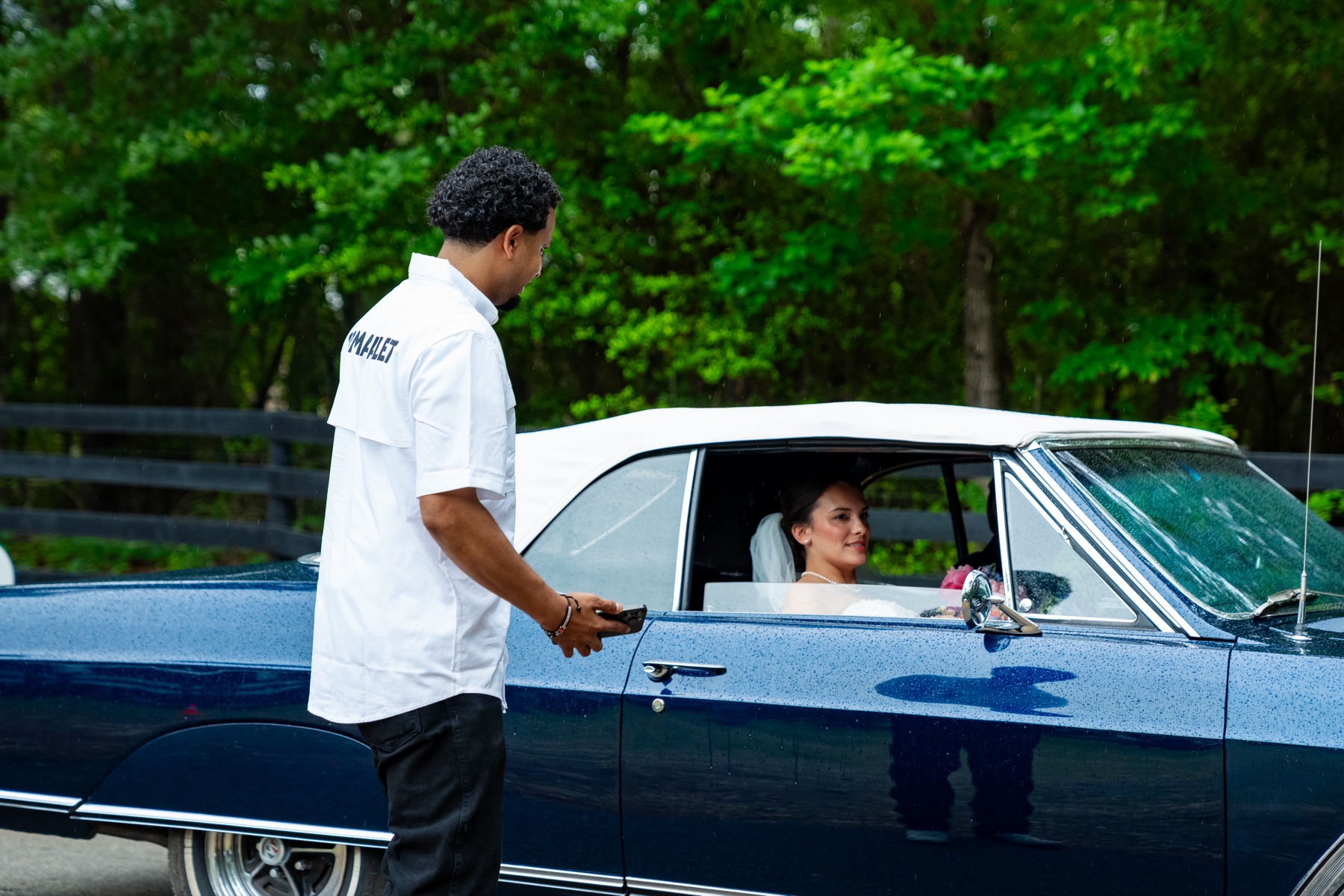 Wedding guest in vintage car